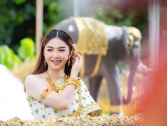 beautiful-woman-thai-traditional-outfit-smiling-standing-temple