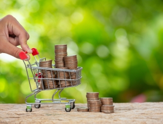 world-habitat-day-close-up-picture-hand-pushing-little-cart-which-full-coins